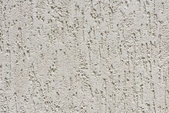 Abbildung einer Wand aus Zementputze im Innenbereich als Hintergrund für Wandfliesen